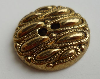 BUTTON SETS: Gold textured metal buttons in two sizes, 5/8 " or 3/4 ",  two holes.  3/4 inch in sets of 7, 1/2 inch in sets of 8.