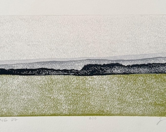 May include: A landscape print featuring a textured olive green foreground, a dark black horizontal band representing a tree line, and layered gray hills in the distance. The text "NOTICING 27" is printed on the bottom left and "6/10" on the bottom center.