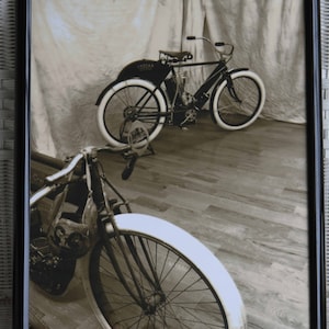 16x20 inch poster of a 1908 Indian motorcycle and a racer in the foreground
