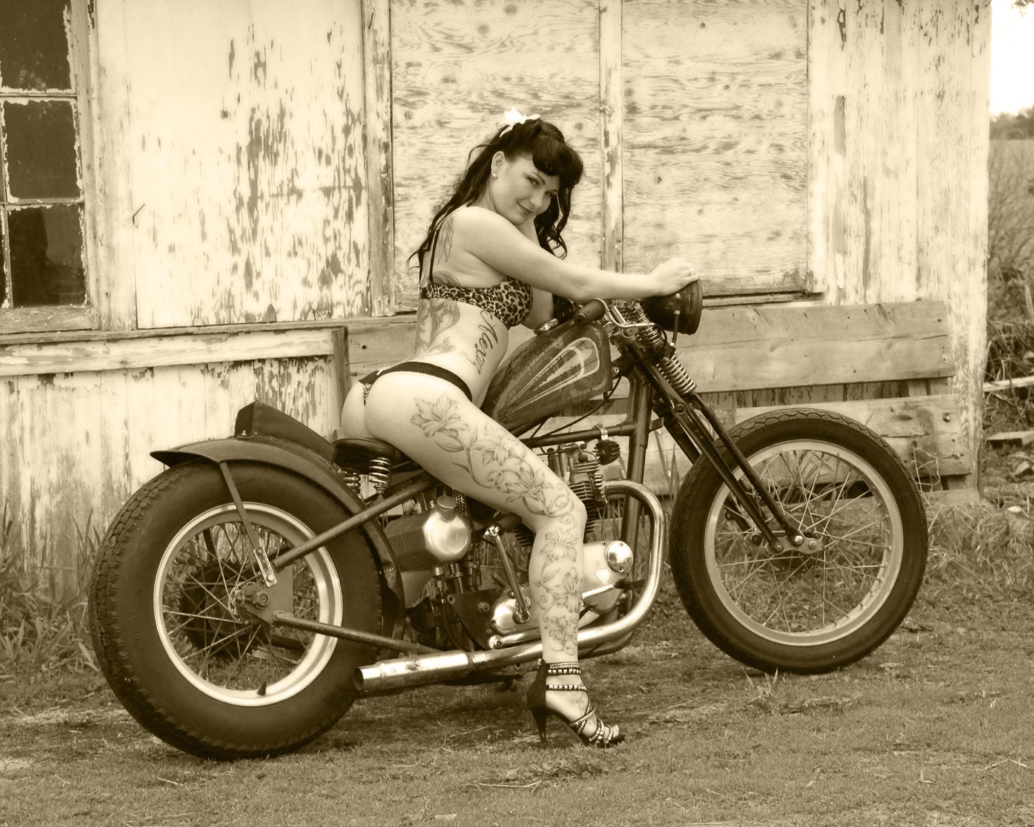 8x10 inch photo of a tattooed babe on a Triumph bobber motorcycle