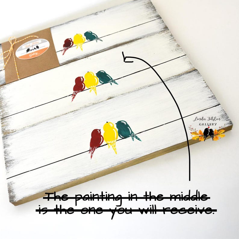 May include: A white distressed wooden sign featuring three horizontal rows, each displaying a trio of birds in red, yellow, and teal perched on a line. A brown paper band wraps around the left side. The text Linda Fehler Gallery is visible.