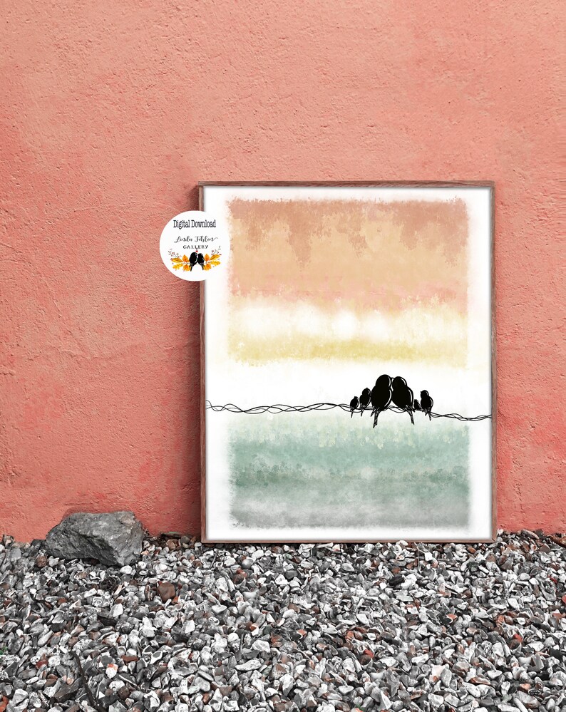 May include: A digital download print featuring a watercolor landscape with a sunset sky in shades of pink, orange, and yellow. A line of black birds sits on a wire in front of a green and blue watercolor background. The text "Digital Download" and "Jorda Studio Gallery" is visible in the image.