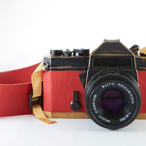 Vintage camera Chinon CS.Film camera Chinon. Working film camera. 35mm SLR camera. Lens Auto Revuenon 50mm. Replaced body cover camera.