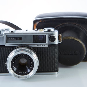 Film camera Yashica Minister D. Lens Yashinon 45mm f/2.8. Working Film camera. Camera.