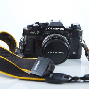 Filmkamera Olympus OM40 Program.Objektiv Olympus Auto-S 50 mm /1,8. Spiegelreflexkamera. Funktionierende Filmkamera.