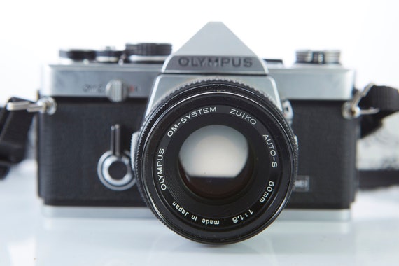 Film camera Olympus OM-2. Lens Olympus OM-System Zuiko Auto