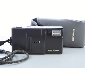 Câmera de filme Olympus AF-1 35 mm: aponte e dispare, à prova de intempéries, com estojo