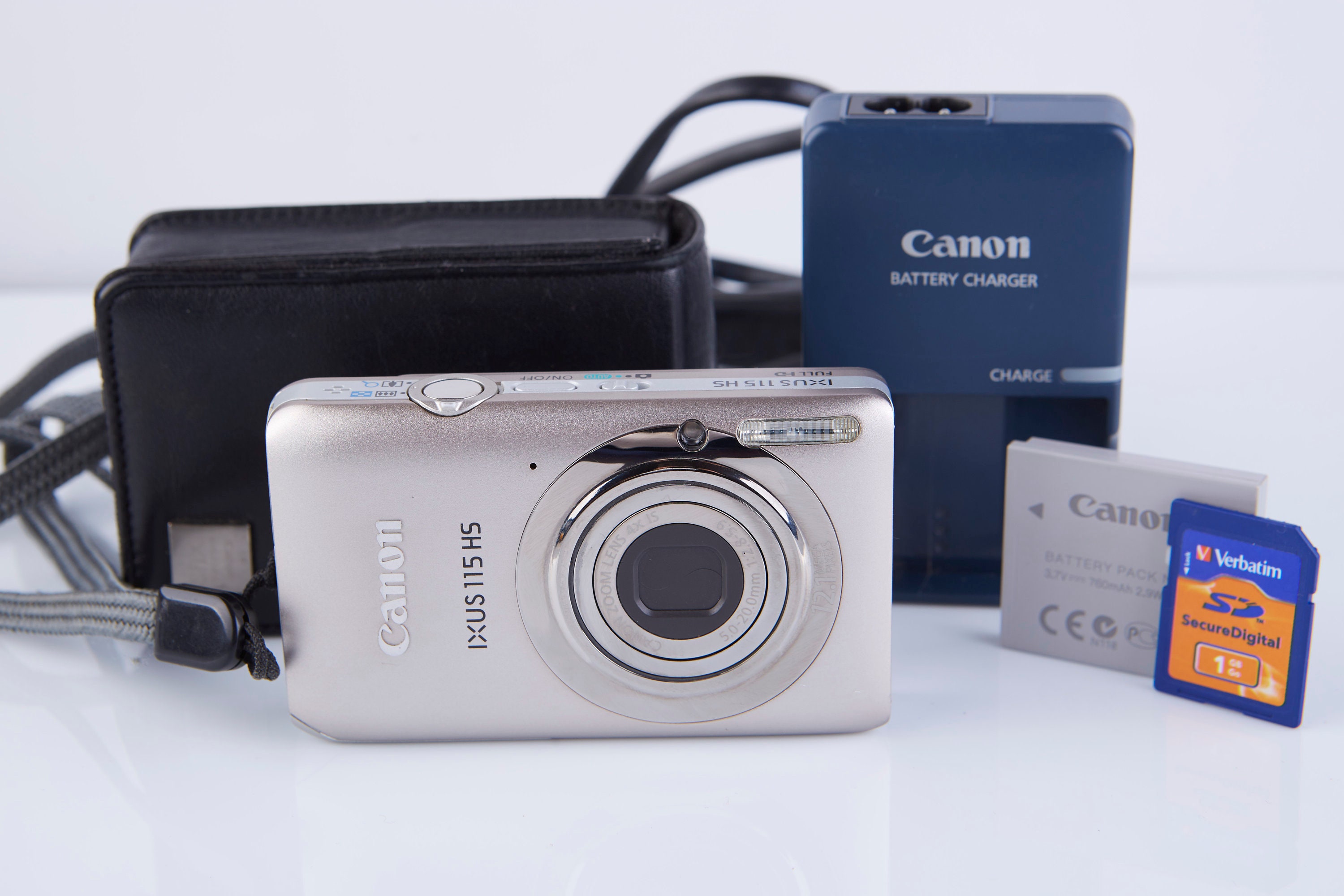Фотоаппарат мыльница canon разбитый. Canon ixus 115 макро фото. Canon ixus 115hs габариты. Фотоаппарат canon ixus 145 коробка. Canon ixus 115 hs.