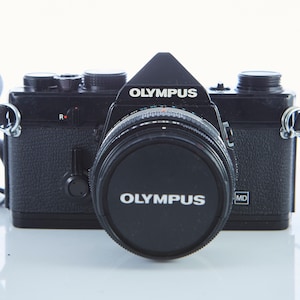 Olympus OM 1 Black Vintage 35mm SLR Film Camera With F/1.8 Olympus OM 1 Black Vintage 35mm SLR Film Camera With F/1.8