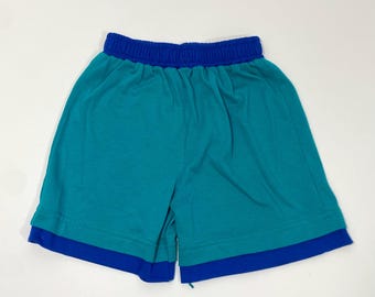 Shorts vintage Healthtex de los años 90 en azul verdoso y azul con cintura elástica, talla 7 - Shorts vintage Healthtex - Shorts suaves - Shorts para niño - Shorts con apariencia de capas