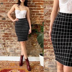 Knee length pleated tartan skirt crossword cheap
