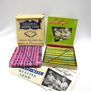 May include: Two vintage weaving looms, one labeled "Colonial Looper Loom" and the other "Loop Craft". Both looms are in their original boxes with colorful yarn and instructions. The Colonial Looper Loom box features a picture of the loom and the text "America's Best Looper Loom with Rounded Base for Easier Weaving". The Loop Craft box features a picture of three children using the loom.