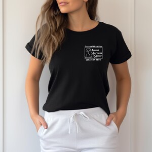 May include: Black t-shirt with a white graphic of a dog and the text "Craven & Pamlico Animal Services Center (252) 637-4606".