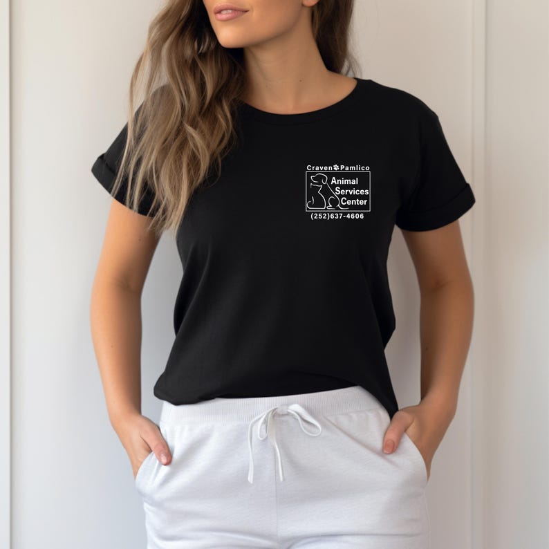 May include: Black t-shirt with a white graphic of a dog and the text "Craven & Pamlico Animal Services Center (252) 637-4606".