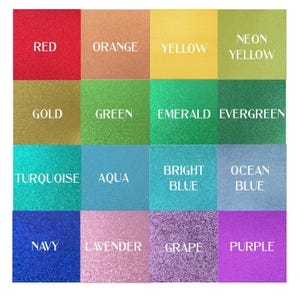 a group of different colors of glitter on a white background