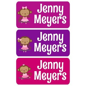 May include: Three pink, purple, and red labels with a monkey wearing a pink tutu and a crown. The labels have the name "Jenny Meyers" printed in white.