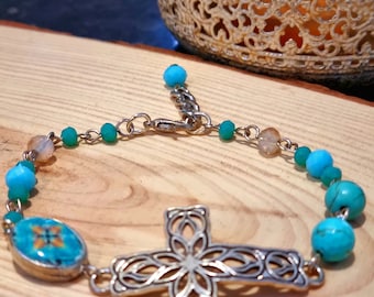 Delicate bracelet with a silver cross and a miniature replica of a tile in turquoise color, Adjustable bracelet.