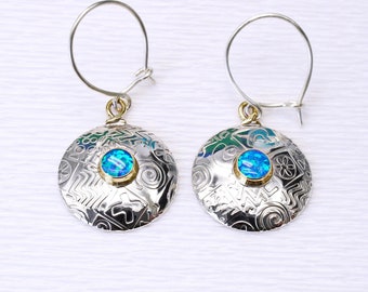 Handmade sterling silver earrings featuring two beautiful blue Opal gemstones, round and domed in shape with a choice of gemstones. L.