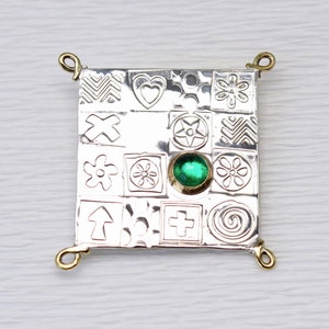Square handmade brooch, made from sterling silver with embossed flowers, star, heart shapes, featuring a green Spinel stone, gemstone choice