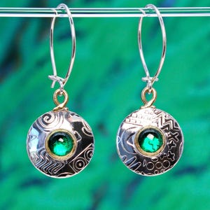 Handmade sterling silver round earrings featuring green spinel gemstones and a unique embossed pattern. A choice of gemstones is available.