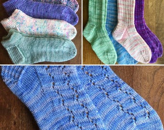 May include: A collection of colorful, hand-knitted socks. The socks feature various patterns and colors, including blue, purple, green, and pink. The close-up shows a blue sock with a diamond pattern. The socks are displayed on a wooden surface.