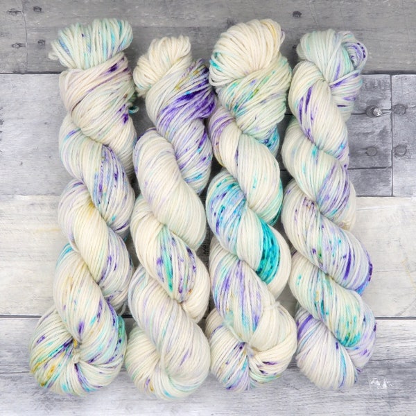 Occamy (Worsted Merino, variegated) - speckled aqua, purple and yellow