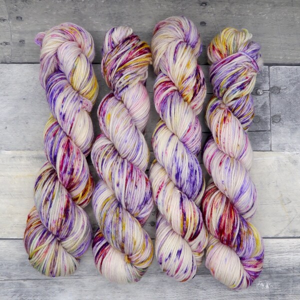 Alohomora (Worsted Merino, variegated) - speckled vibrant pink, purple and yellow