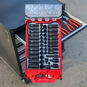 May include: A red and black tool box with a variety of black socket wrenches. The box is open and the wrenches are visible. The box is labeled "Sturdily Built Your System".