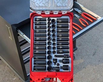May include: A red and black tool box with a variety of black socket wrenches. The box is open and the wrenches are visible. The box is labeled "Sturdily Built Your System".