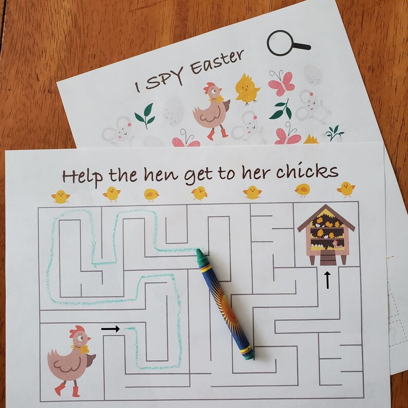 May include: A printable Easter-themed maze activity for kids. Help the hen get to her chicks by tracing the path through the maze. The maze is printed on white paper with a green crayon.