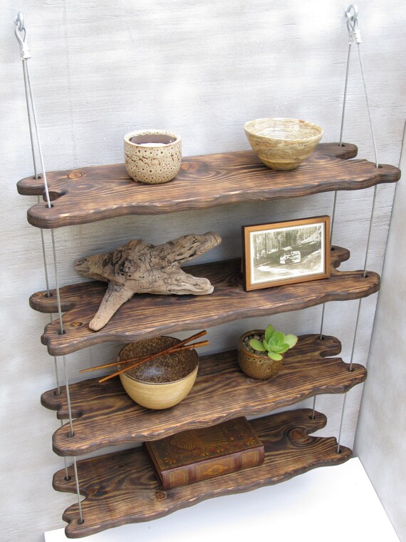 Industrial design can be elegant, as shown by this wall shelf. driftwood shelves display shelving shelving system wall shelves pottery shelf