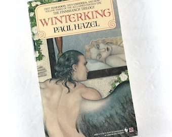 May include: Book cover for "Winterking" by Paul Hazel, the third book in the Finnbranch Trilogy. The cover features a man with wings and a woman sleeping in a bed. The background is a light blue and white.
