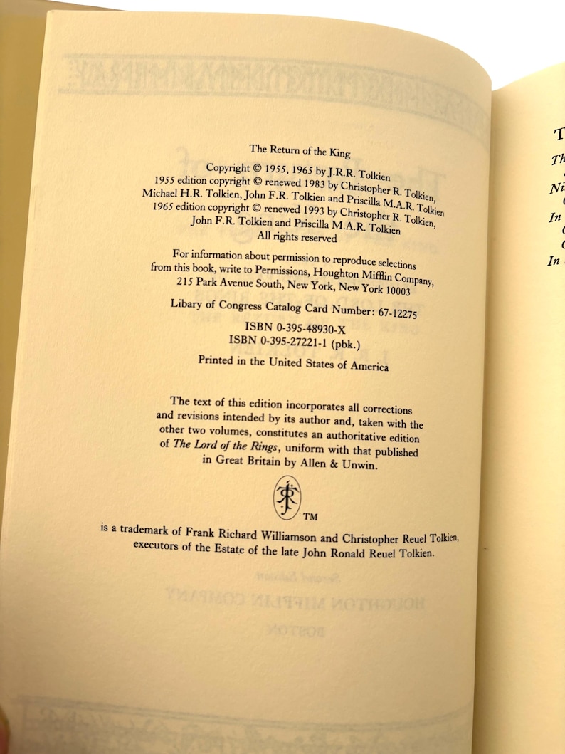 May include: Open book page with text from "The Return of the King" by J.R.R. Tolkien. Copyright information, ISBNs, and Library of Congress Catalog Card Number are visible. The text is printed in the United States of America.