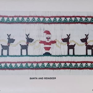 May include: A Christmas-themed design featuring Santa Claus and reindeer. The image shows a repeating pattern of Santa Claus and reindeer, with green and red decorative borders. The text "SANTA AND REINDEER" is displayed below the image.