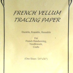 May include: A sheet of French vellum tracing paper. The cream-colored paper has black text that reads "French Vellum Tracing Paper." The text below states "Durable, Erasable, Reusable" and "For French Handsewing, Needlework, Crafts." The sheet measures 24" x 36".