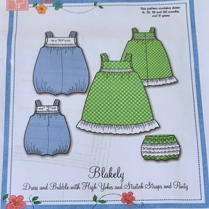 May include: A sewing pattern titled "Blakely" featuring illustrations of a dress, bubble, and panty. The dress is green with white polka dots, and the bubble is blue. The pattern includes sizes for 6, 12, 18, and 24 months, and 3 years.