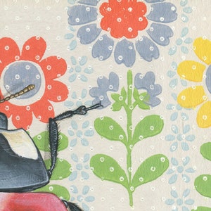 May include: A black and white beetle with long legs sits on a red flower with white polka dots. The background is a white fabric with a repeating pattern of blue, green, and yellow flowers with white polka dots.