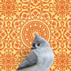 May include: A gray and white tufted titmouse perched on a background of orange and yellow mandala pattern.