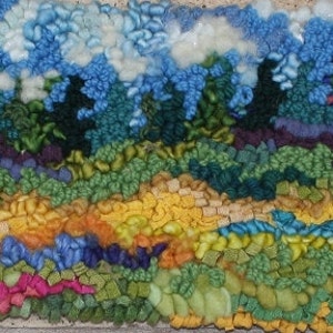 May include: A rectangular textile wall hanging featuring a landscape scene created with textured wool loops. The design displays a vibrant field of pink, green, yellow, and blue flowers in the foreground, transitioning to dark green trees and a sky filled with fluffy white and light blue clouds.