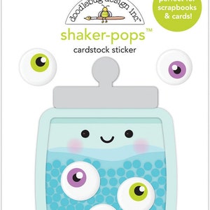 May include: A cardstock sticker set featuring a baby bottle design with a smiling face and three colorful eye stickers. The bottle is filled with blue dots and the eyes are purple, green, and orange. The packaging includes the text "shaker-pops" and "cardstock sticker".
