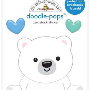 May include: A cardstock sticker sheet featuring a white polar bear design with black eyes and a black nose. The sticker sheet also includes two heart-shaped stickers, one blue and one teal. The text "doodle-pops" and "cardstock sticker" are printed on the sheet.