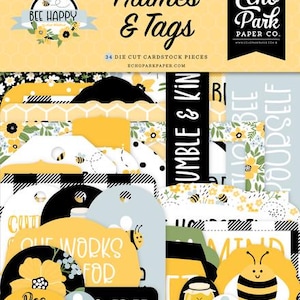 Puede incluir: Un conjunto de 34 piezas de cartulina troqueladas con temática de abejas. Las piezas incluyen marcos, etiquetas y sentimientos con frases como "Bee Happy", "Humble & Kind" y "Our Works For Free".