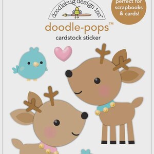 May include: Doodle-pops cardstock sticker sheet featuring cartoon deer, blue birds, and pink hearts. The deer are brown with antlers and wear decorative collars. The birds are light blue. The text says "perfect for scrapbooks & cards!"