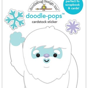 May include: A cardstock sticker sheet featuring a white yeti character with blue accents, a snowflake, and a flower. The sticker sheet has the text "doodle-pops" and "cardstock sticker". The packaging also includes the text "perfect fo scrapbook & cards!"