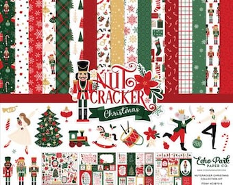 May include: A Christmas-themed papercrafting kit featuring a variety of patterned papers in red, green, and white. The kit includes decorative stickers and elements with nutcracker, Christmas tree, and ballet motifs. The text "Nutcracker Christmas" is prominently displayed.