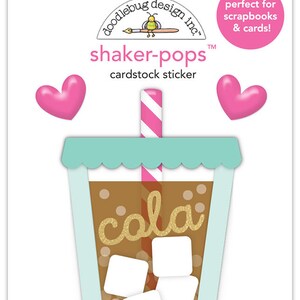 May include: A cardstock sticker pack featuring a cola-themed design. The sticker includes a brown cola cup with ice cubes, a pink and white striped straw, and the word "cola" in gold glitter. Two pink heart stickers are also included.
