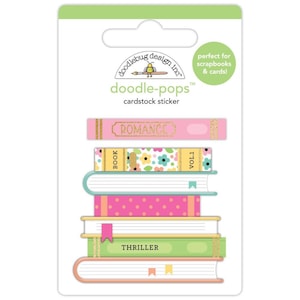 May include: Cardstock sticker sheet featuring stacked book designs. The top book reads "ROMANCE" in gold lettering. Other books include floral and polka dot patterns, with the word "THRILLER" on the bottom book. The packaging includes the text "doodle-pops" and "perfect for scrapbooks & cards!"