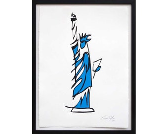 May include: A black and white line drawing of the Statue of Liberty in blue. The drawing is framed in a black frame. The artist's signature is in the bottom right corner.