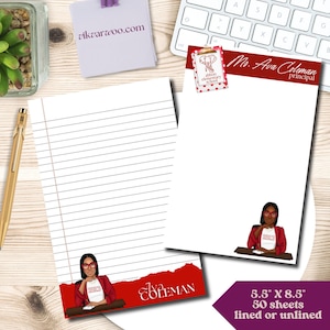 May include: Red and white lined notepad with a red border and a cartoon image of a woman wearing glasses and a red blazer. The notepad has the text "Ava Coleman" and "5.5" x 8.5" 50 sheets lined or unlined".