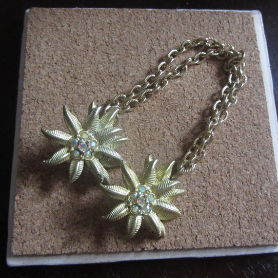 1950s gold flower sweater guard | 50's mid century